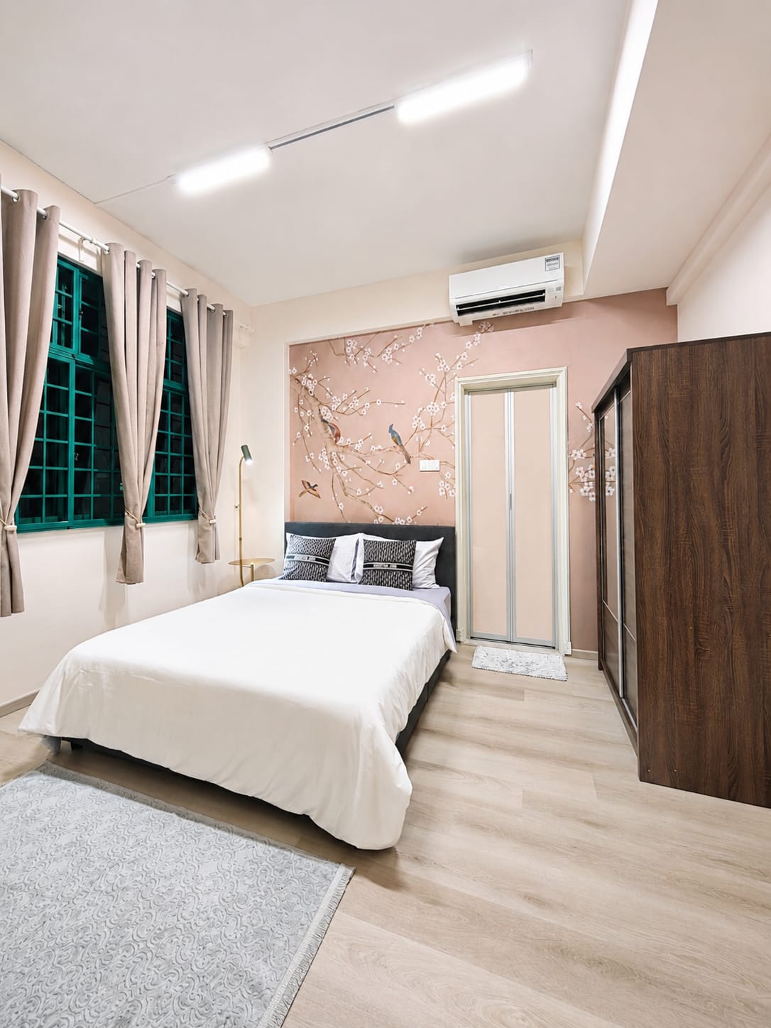 Bedroom with floral feature wall in an SK-managed residence